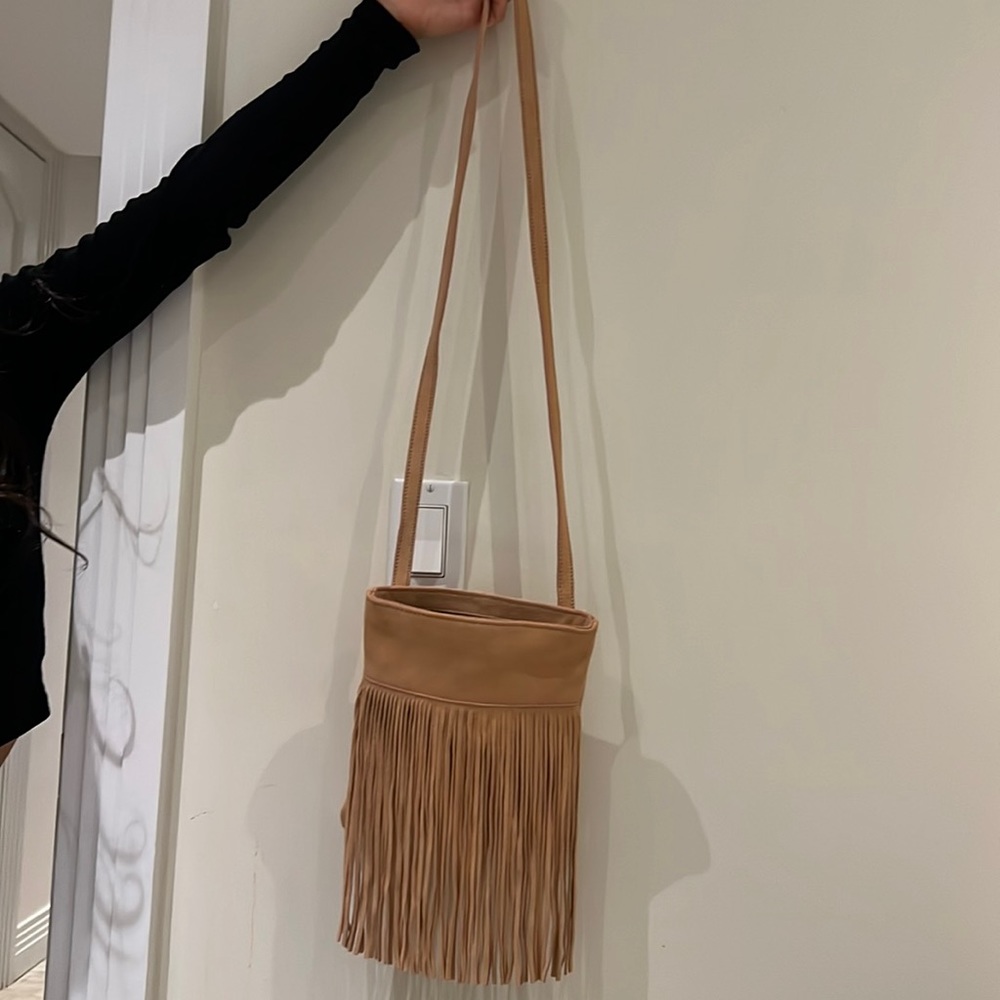 Two pocketed pink fringe suede  bag